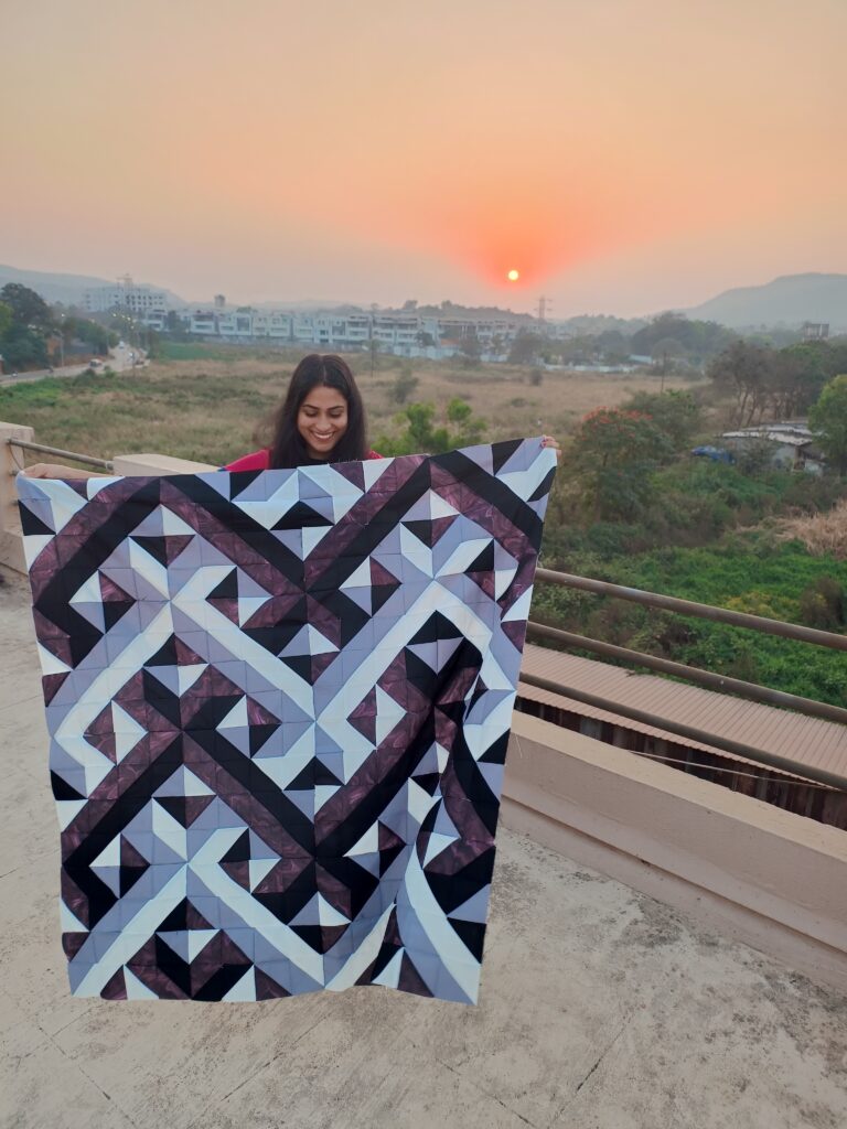 Finished lap-size quilt made from over 700 half-square triangles